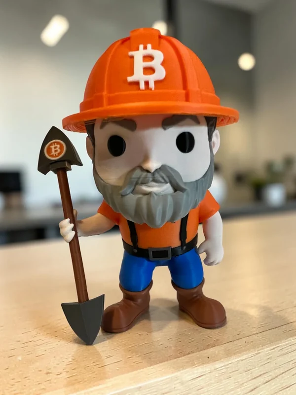 XL Collection Bitcoin Miner Figure with orange hard hat, blue pants and brown boots
